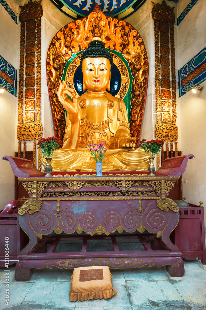Golden statue of Buddha in Po Fook Memorial Hall (columbarium), Sha Tin, Hong Kong