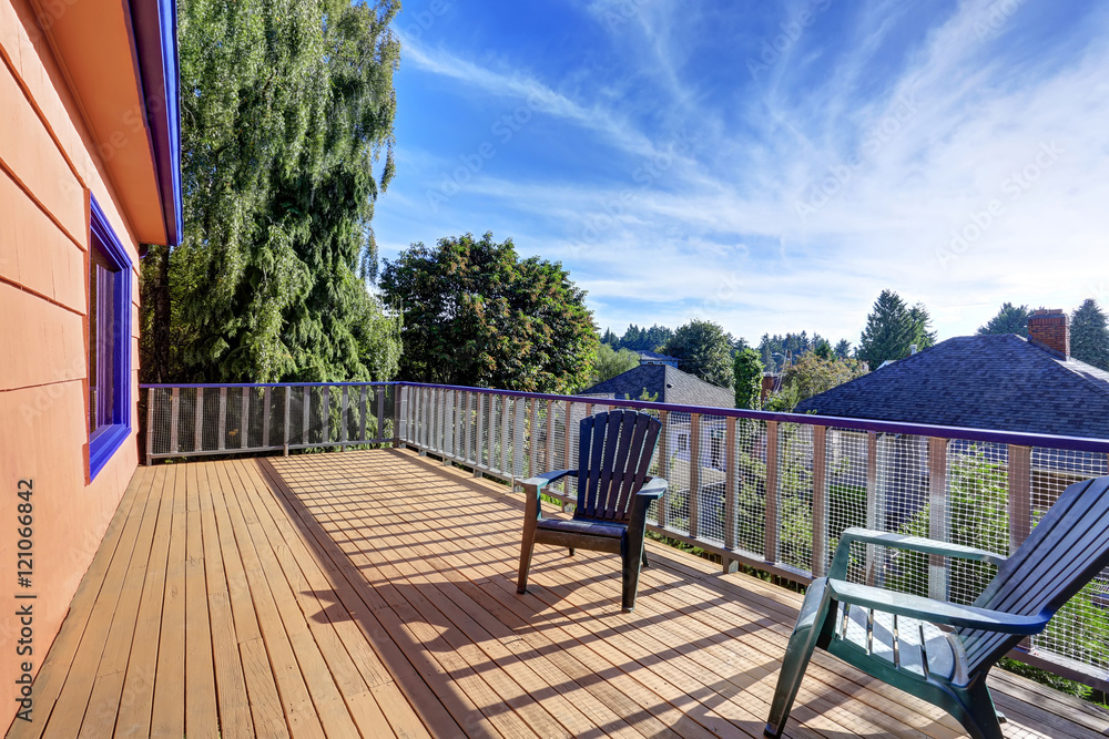 Wooden floor balcony with two chairs and perfect view
