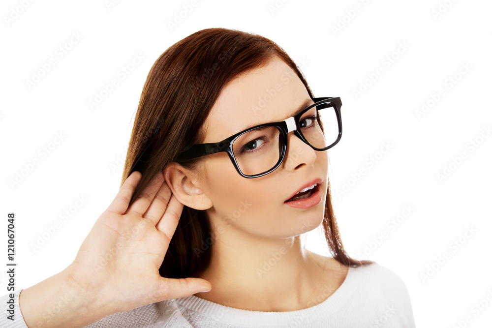 Shocked young woman overhearing a conversation Shocked young woman overhearing a conversation