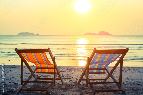 Two sunbeds on the sea beach.