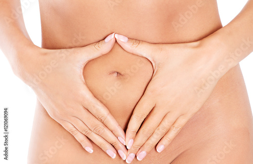 Hands on slim female belly