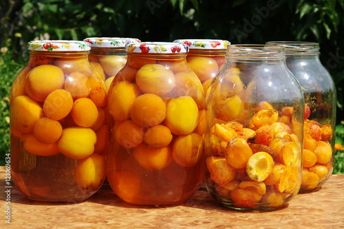 Ripe apricot fruits in glass jars for canning.