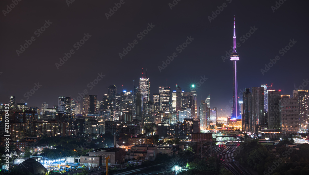 Urban lighted landscape of Toronto.   A balcony view of  lighted streets, parks, buildings and office towers on a hot & humid August night in capitol of Ontario, Canada.