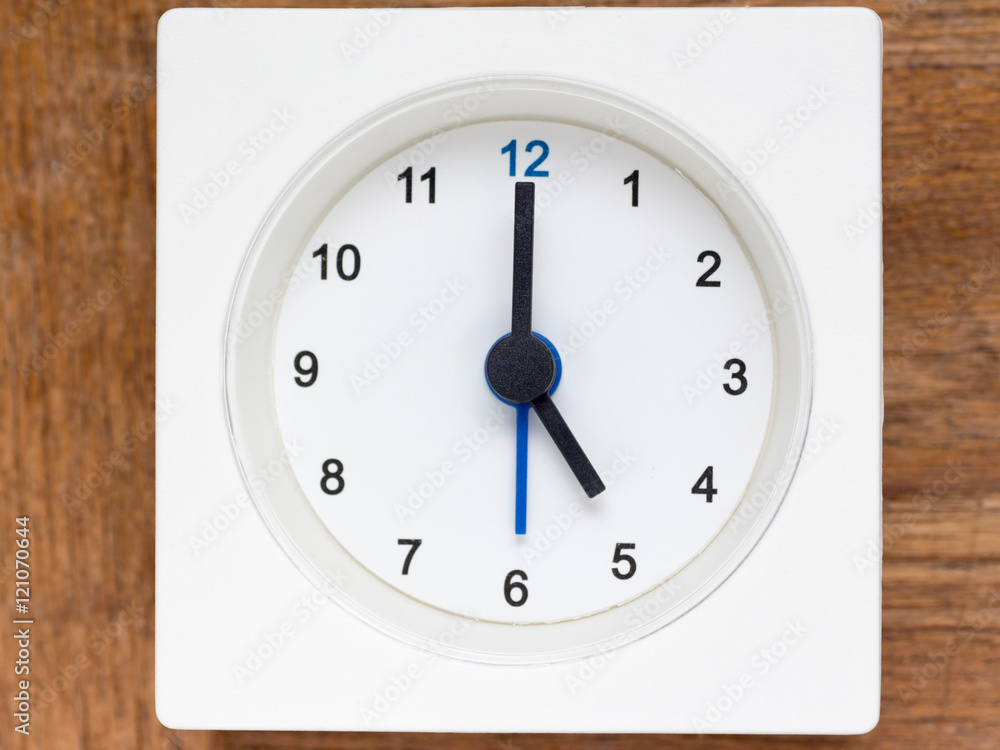 Series of the sequence of time on the simple white analog clock Series of the sequence of time on the simple white analog clock