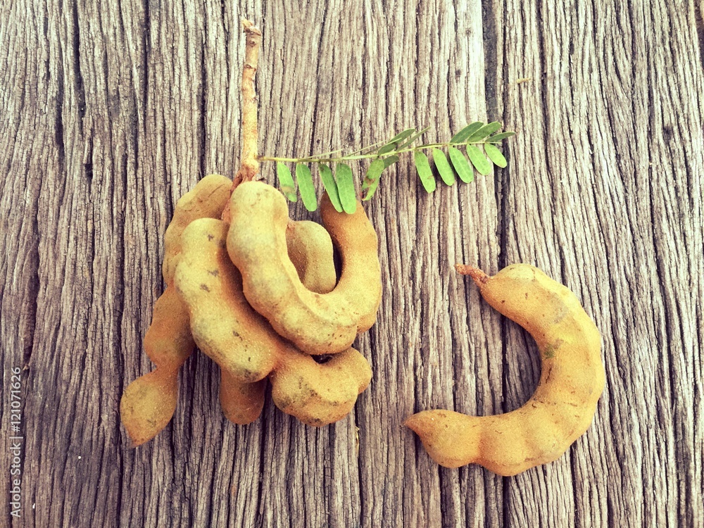 Tamarind on wood background Tamarind on wood background