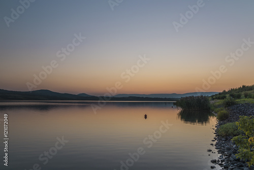 Sunset near Milada lake in summer evening