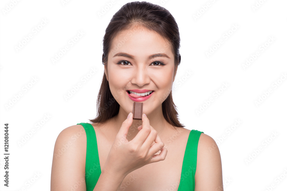 Portrait of a young asian woman holding a chocolate bar to enjoy Portrait of a young asian woman holding a chocolate bar to enjoy