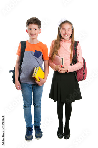 A schoolgirl and schoolboy with book and backpack, isolated on white background
