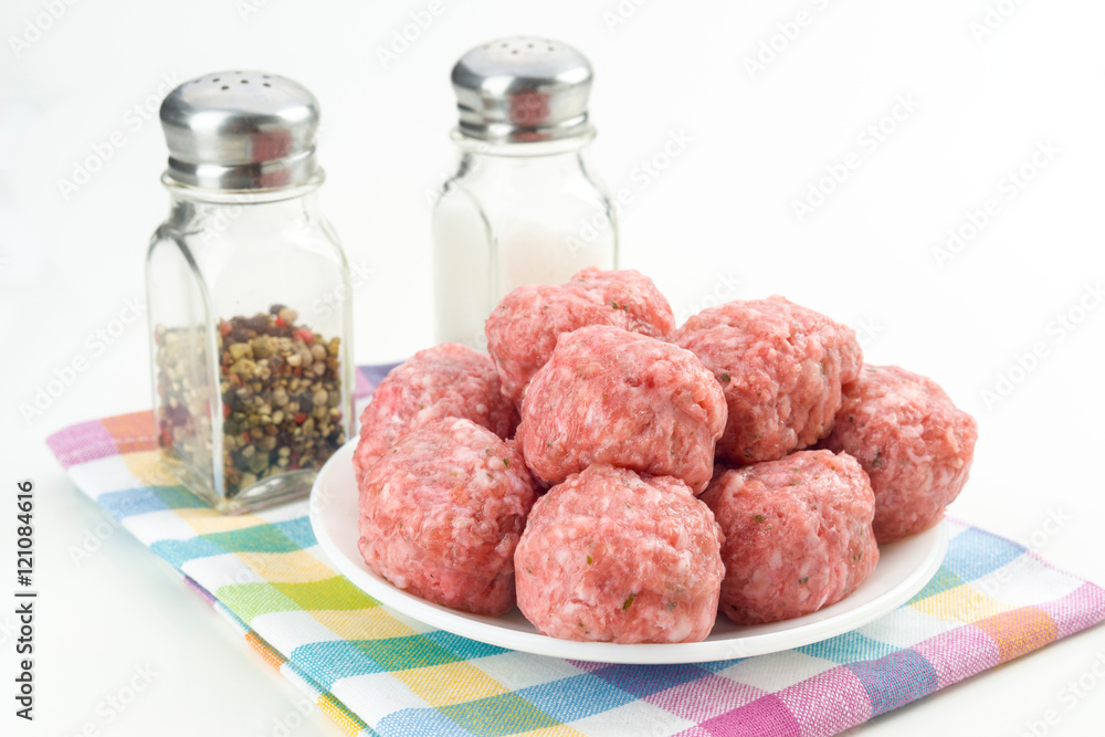 raw homemade meatballs prepared for cooking, isolated raw homemade meatballs prepared for cooking, isolated
