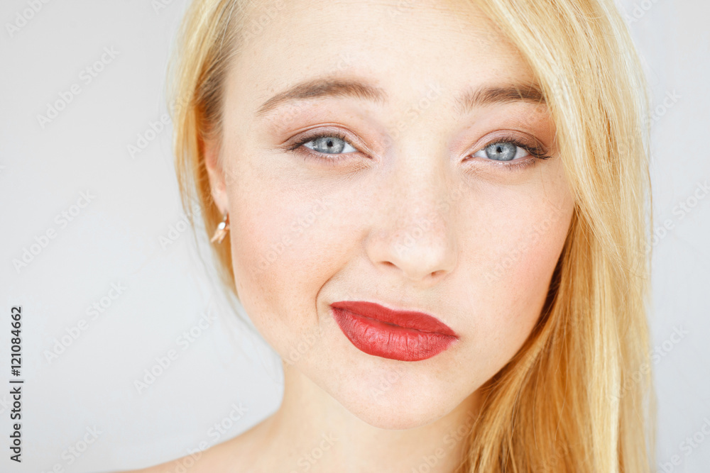 Skeptically smiling at camera red-haired woman. Foxy girl with freckles and doubtful look portrait. Disbelief, doubt, challenge concept Skeptically smiling at camera red-haired woman. Foxy girl with freckles and doubtful look portrait. Disbelief, doubt, challenge concept