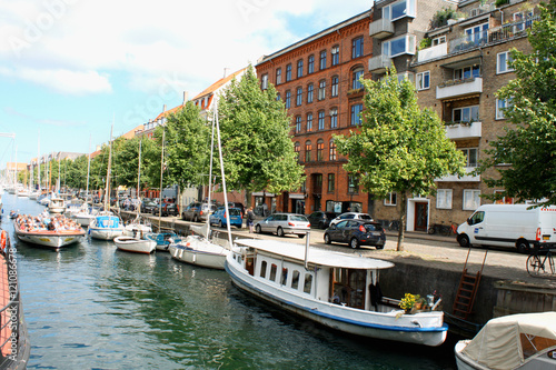 Scenic summer view of color buildings and water canals in Copehnagen. photo