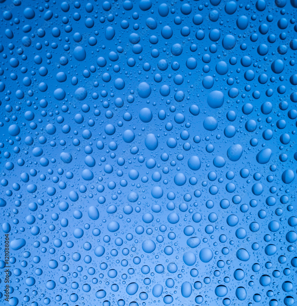 Abstract rain dropson blue background