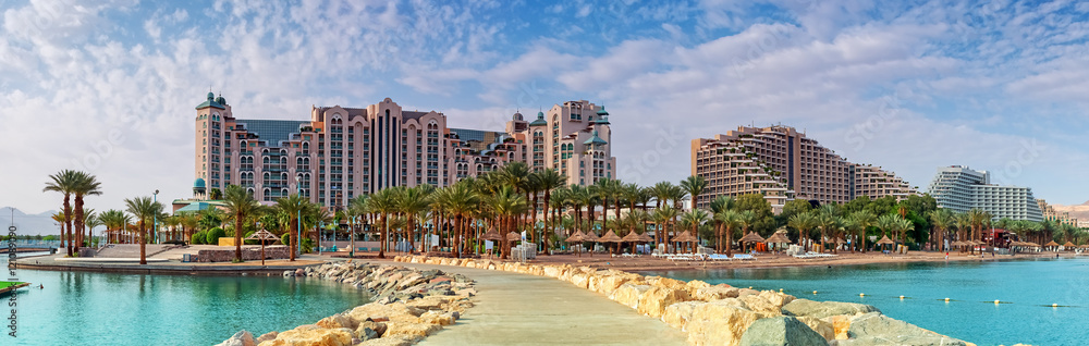Central public beach of Eilat at sunset. Eilat is a famous resort city in Israel