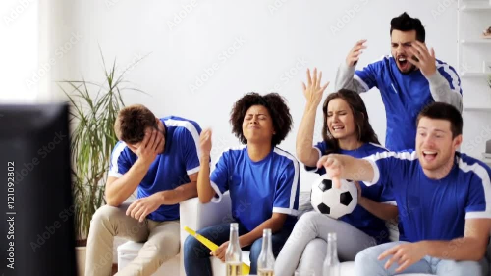 friends or football fans watching soccer at home