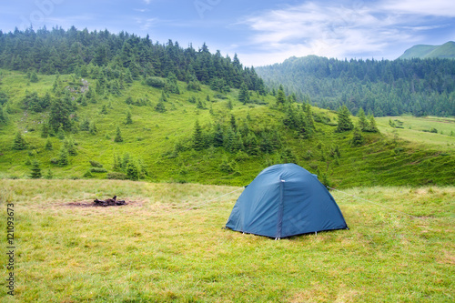tent on meadow in mountains
