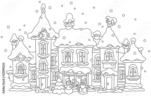 toy houses covered with snow on Christmas