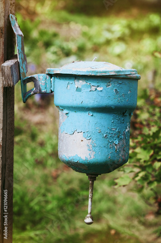 фотографія Old vintage washstand hanging outdoors, retro toning