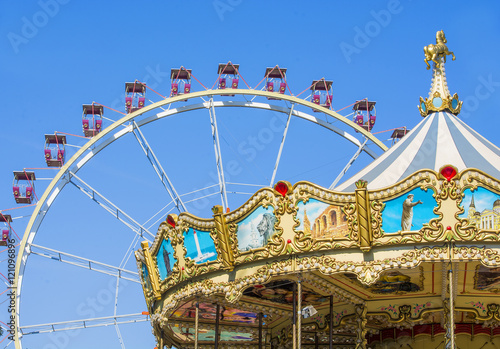 Carousel and ferris wheel in the park