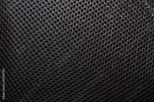 Polyester texture. The breathable material. The holes for air. The back of the backpack photo