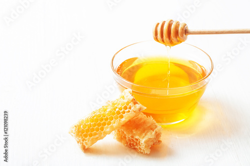 Honey with and wooden spoon