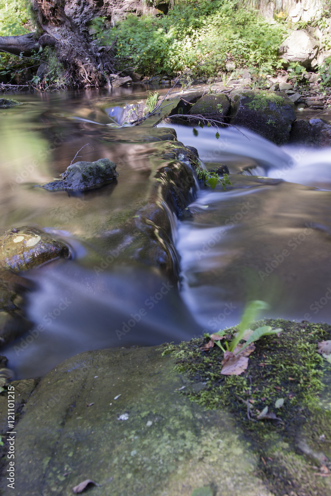 River with small waterfall. River with small waterfall.