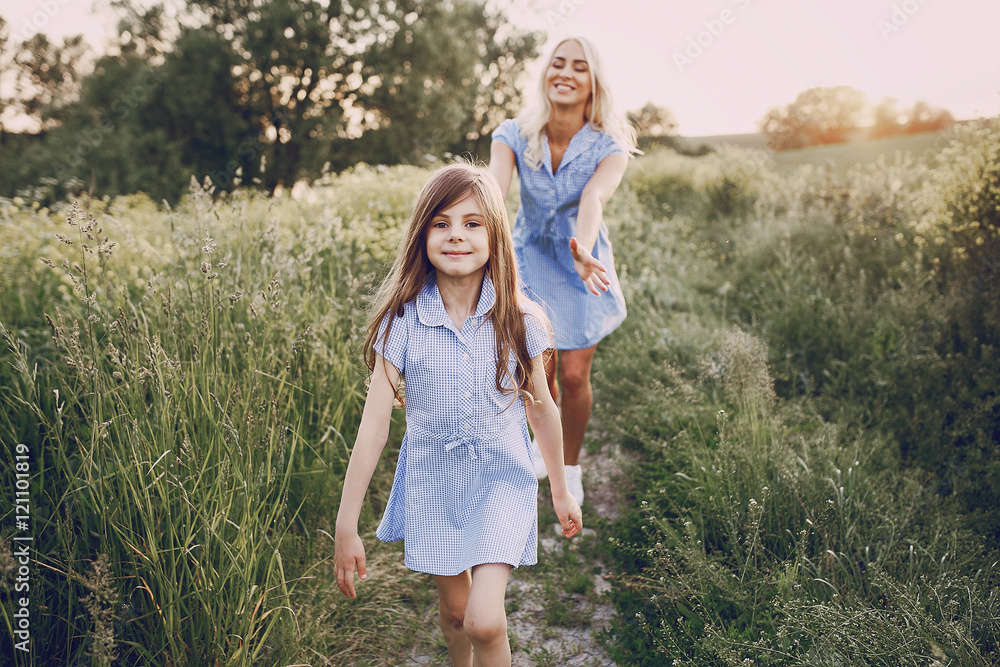 Fototapeta premium mom and daughter outside