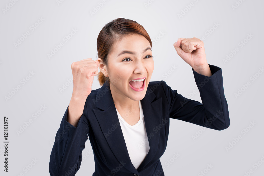 Close-up of an excited businesswoman celebrating with arms up Close-up of an excited businesswoman celebrating with arms up