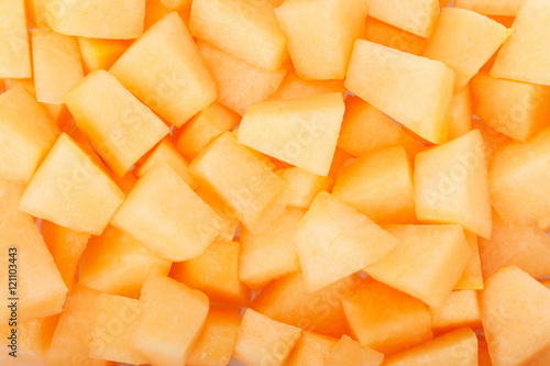 Cantaloupe melon pieces texture background photo