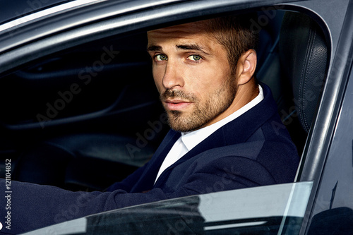 фотографія Handsome man in the car. Luxury life.