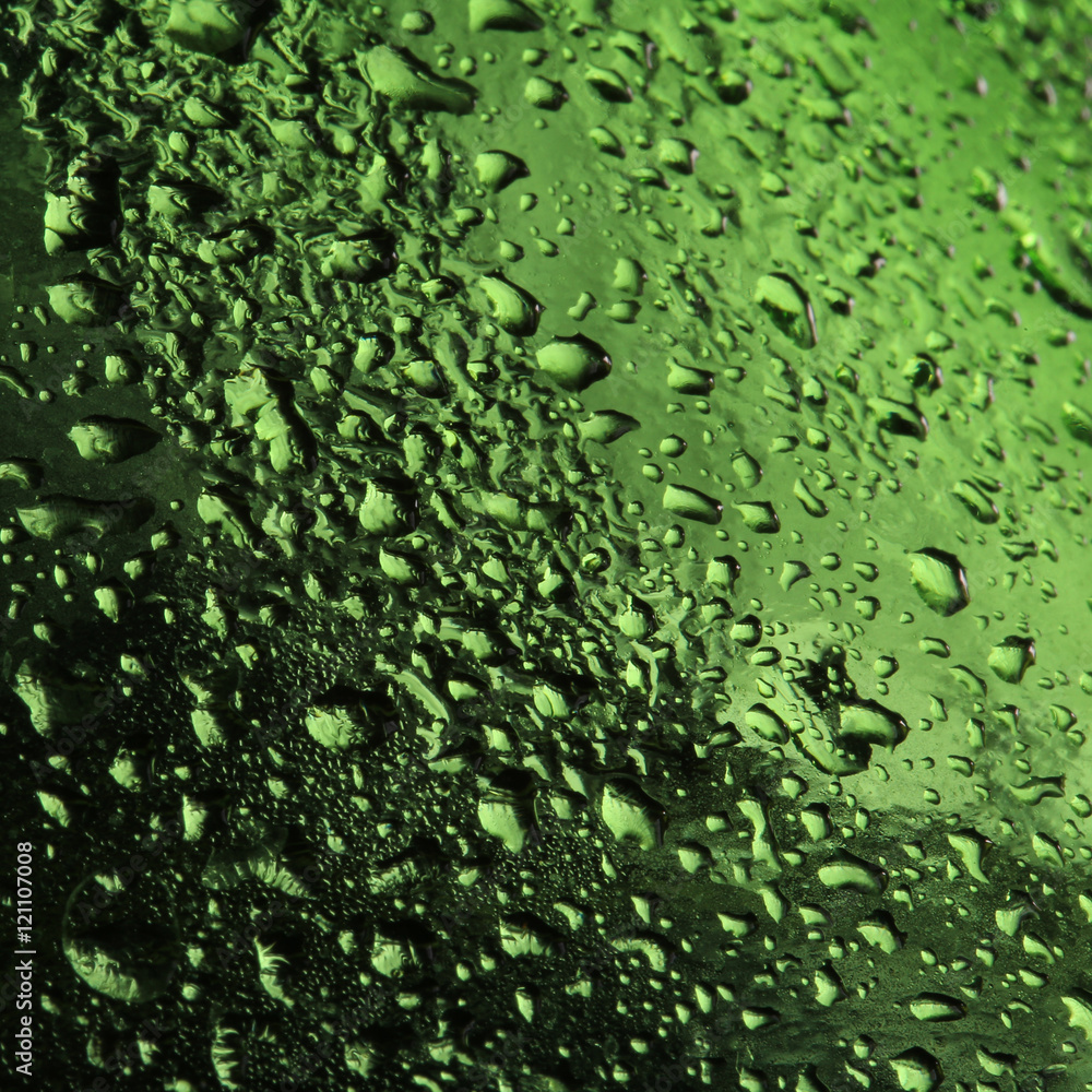 drops on green glass drops on green glass