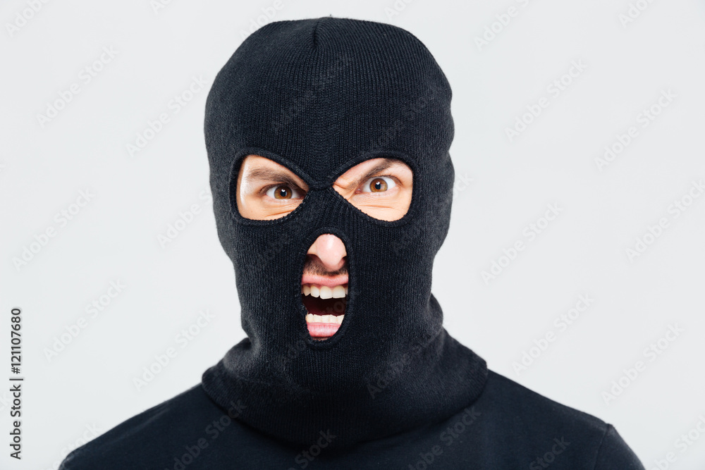 Portrait of mad furious man in balaclava Portrait of mad furious man in balaclava