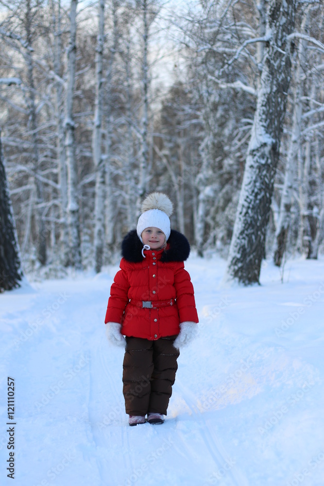 little girl walking through the forest frosty winter day