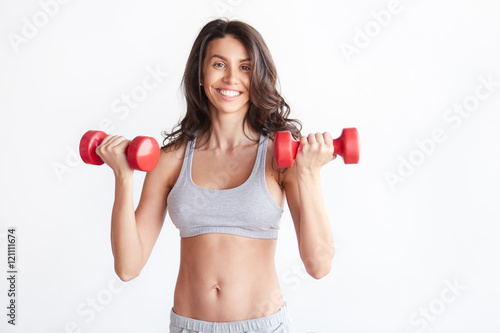 sporty woman with dumbbells