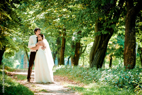 happy bride and groom on a walk in beautiful forest