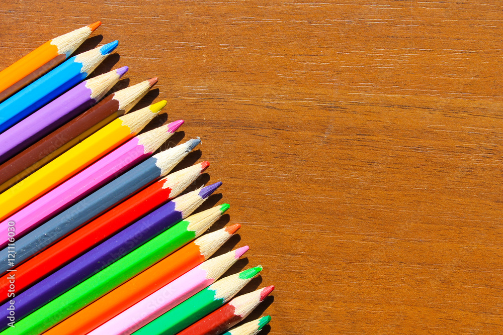 Colourful pencils on wooden background Colourful pencils on wooden background