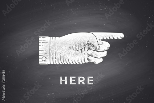 Vintage drawing of hand sign with pointing finger in engraving retro style, drawing on chalkboard with text Here. Old drawn pointing finger for sign, information sign, navigation. Vector Illustration