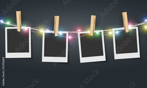 Blank photo frame hanging on rope with colorful fairy lights Vector