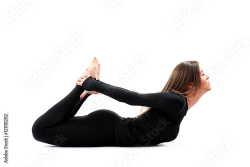 Woman practicing Yoga in a Studio 