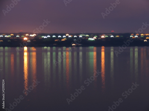 Colorful reflection of night city lights in the water