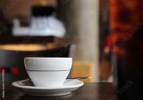 Black coffee on wood background in coffee shop
