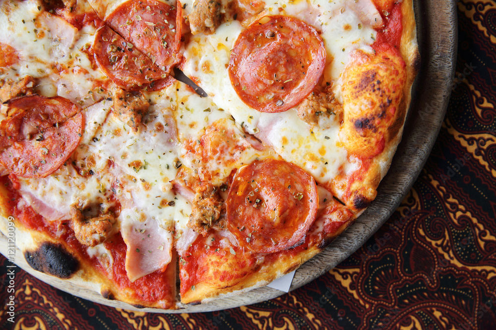 pepperoni pizza on wooden