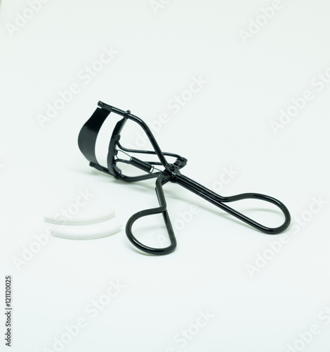 Black eyelash curler isolated on white