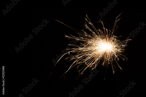 Firework Sparkler on black background, close-up. with copy space