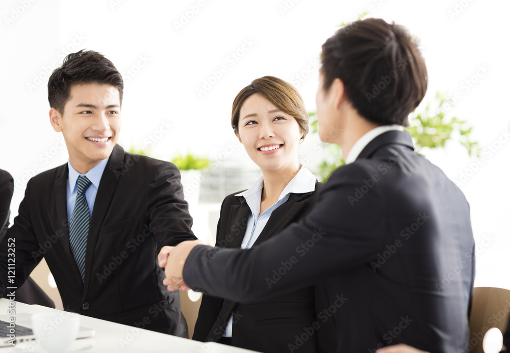 business people shaking hands during meeting business people shaking hands during meeting