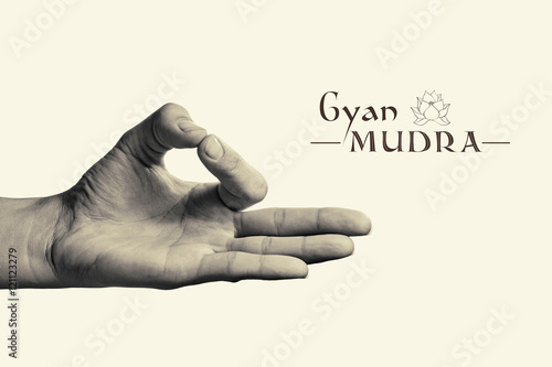 B/W image of woman hand in gyan mudra. Gesture is  isolated on toned background. photo