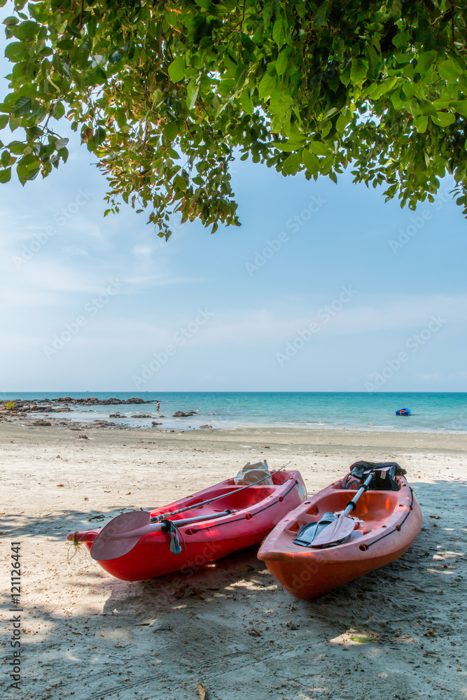Kayak on the tropical beach,Thailand.Image contain certain grain or noise. Kayak on the tropical beach,Thailand.Image contain certain grain or noise.