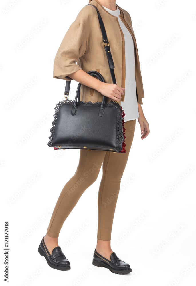 Woman holding a handbag isolated on white background Woman holding a handbag isolated on white background