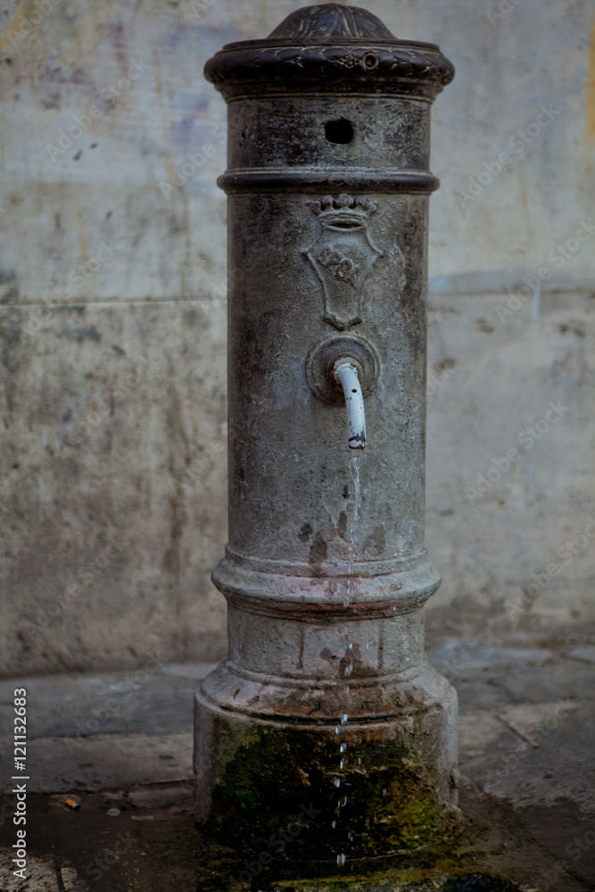Old street cock with drinking water Old street cock with drinking water