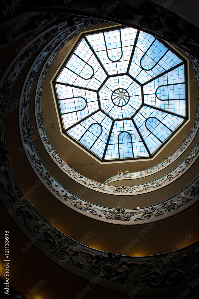 Look from below at spiral stairs leading to glass roof Look from below at spiral stairs leading to glass roof