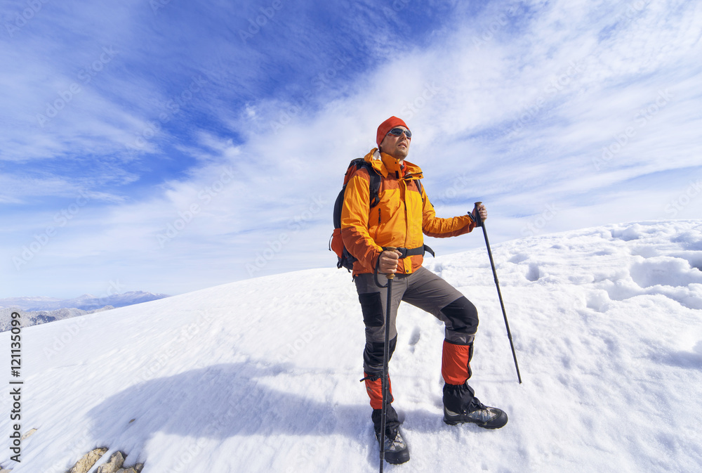 Winter hiking in the mountains with a backpack. Winter hiking in the mountains with a backpack.